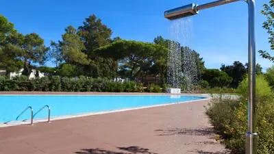 a swimming pool with a water fountain at Vila Leonor - Clever Details , Central Vilamoura, Sleeps 6, luxury, walking distance in Vilamoura