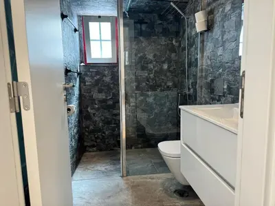 a bathroom with a shower and a toilet and a sink at Old Fisherman's Corner 5 - Centro Old Town Albufeira in Albufeira