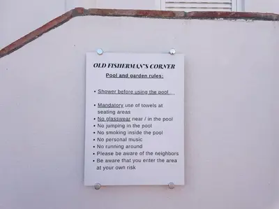 a sign on the side of a building at Old Fisherman's Corner 5 - Centro Old Town Albufeira in Albufeira