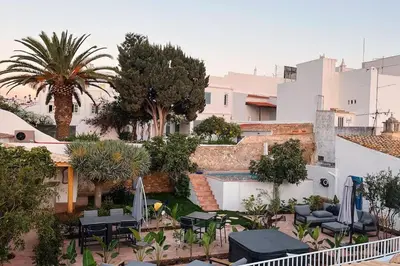 a view of a courtyard with chairs and a pool at Old Fisherman's Corner 5 - Centro Old Town Albufeira in Albufeira