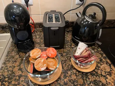 a counter with a bowl of food and a tea kettle at ALDEIA DAS AÇOTEIAS VILLAGEs in Albufeira