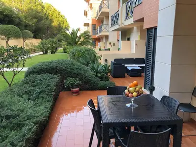 a table with a bowl of fruit on a patio at ALBUFEIRA BEACH in Albufeira