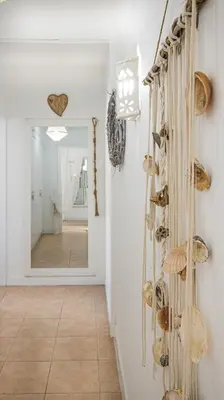 a hallway with shells on the wall and a mirror at Villa O Canto da Parra - Hot Jacuzzi - Swimming Pool - WIFI - BY BEDZY in Galé