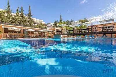 a large swimming pool with a resort style swimming pool at Balaia Beach by MTPhomes in Albufeira