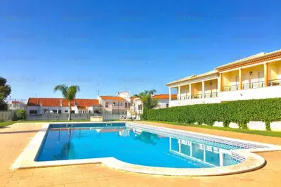 an image of a swimming pool in a villa at São João das Areias By Albufeira Rental in Albufeira