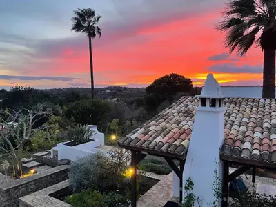 a lighthouse on a roof with a palm tree at Einzigartige Landhaus-Villa mit Pool, Sauna, Bar und BBQ in Boliqueime