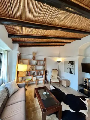a living room with a couch and a coffee table at Einzigartige Landhaus-Villa mit Pool, Sauna, Bar und BBQ in Boliqueime