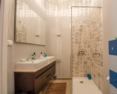 a bathroom with a sink and a shower at Einzigartige Landhaus-Villa mit Pool, Sauna, Bar und BBQ in Boliqueime