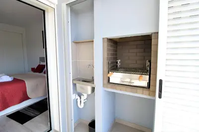 a bathroom with a sink and a bed in a room at Albufeira Prestige With Pool by Homing in Albufeira
