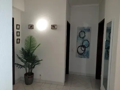 a hallway with a door and a tile floor at Blue Algarve in Albufeira