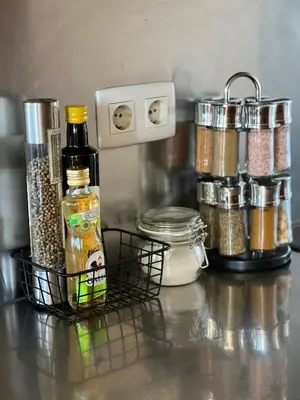 a counter with a bunch of spices and jars of food at Salgados, Vila das Lagoas in Albufeira