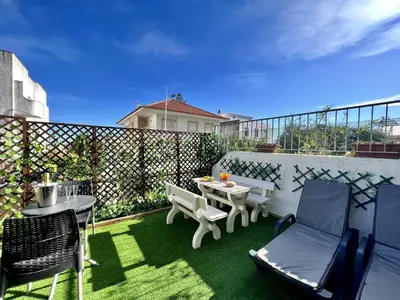 a patio with a table and chairs on a balcony at Albufeira Stylish 1 by Homing in Albufeira