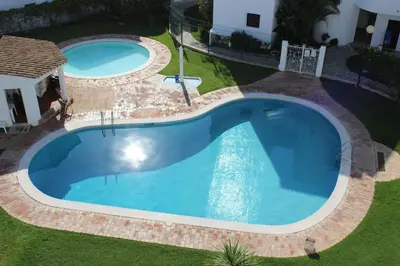 an overhead view of a swimming pool in a yard at Beach Apartment Terrace in Vilamoura