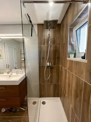 a bathroom with a shower and a sink at OmniaX Apartment in Faro