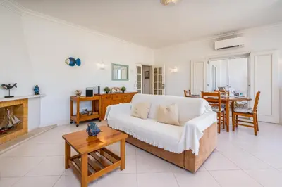 a living room with a couch and a table at Vilamoura City Centre Flat in Vilamoura