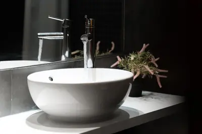 a white bowl sink with a faucet in a bathroom at Apartamento Portugal in Quarteira