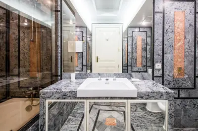 a bathroom with a white sink and a tub at Cypress Villa in Albufeira