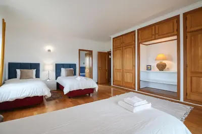 a bedroom with two beds in a room at Villa Alfazema in Albufeira