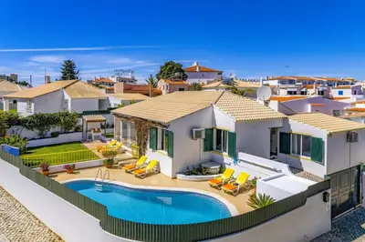 an aerial view of a house with a swimming pool at Villa Pinheiro Oura by Villa Plus in Albufeira