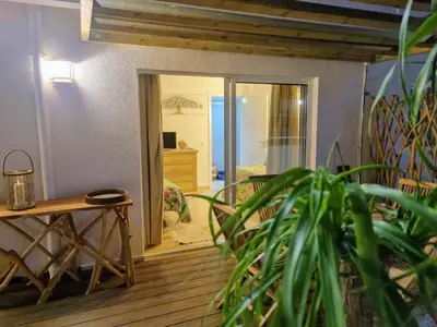 a living room with a door open to a bedroom at Penthouse Rentalbufeira in Albufeira