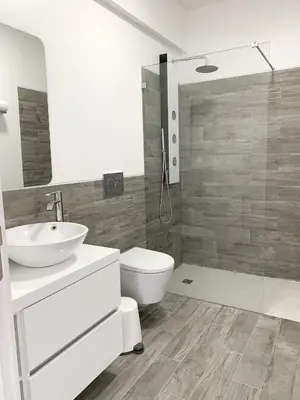 a bathroom with a sink and a toilet and a shower at DIANA BEACH HOUSE in Albufeira