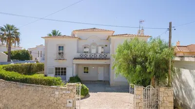 a villa with a swimming pool and a patio at Villa Galé in Guia