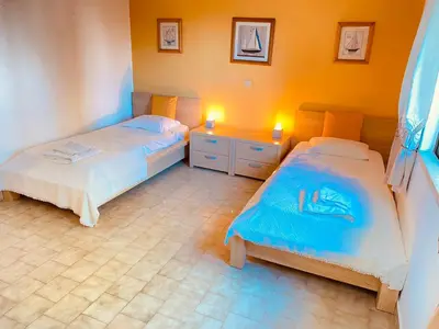 two beds in a room with two lights on at Albufeira Praia São Rafael Sun Apartment in Albufeira