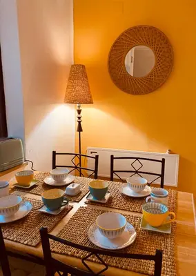 a dining room table with bowls and plates on it at Albufeira Praia São Rafael Sun Apartment in Albufeira