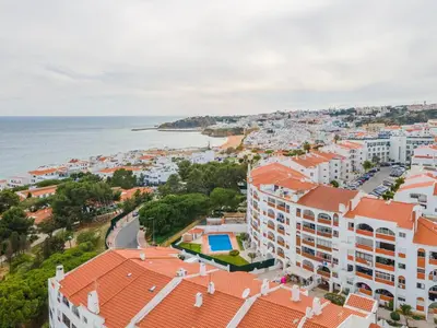 an aerial view of a city and the ocean at Palmeiras Apartment - 19A by HelloVacations in Albufeira