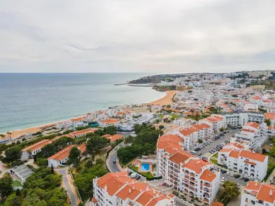 an aerial view of a city and the ocean at Palmeiras Apartment - 19A by HelloVacations in Albufeira