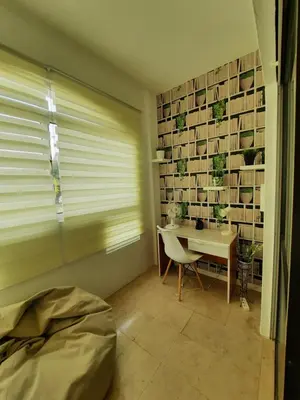 a room with a table and a chair and a window at Casa Cerro Sol in Albufeira