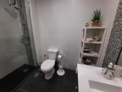 a bathroom with a toilet and a sink at Casa Cerro Sol in Albufeira