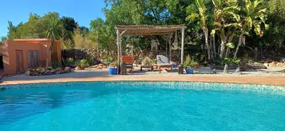 a swimming pool in a yard with a gazebo at Rural Peace in the Algarve - Private Room with kitchenette and bathroom in Aldeia dos Matos