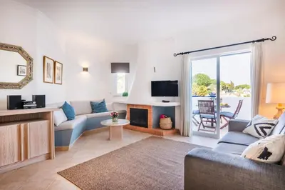 a dining room with a table and chairs on a patio at Albufeira Premium Charming Stays in Albufeira