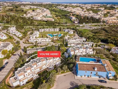 an aerial view of a city with white buildings at Albufeira Premium Charming Stays in Albufeira