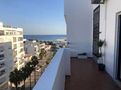 an apartment balcony with a view of a city at Bmar in Quarteira