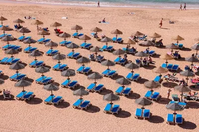 an overhead view of a beach with chairs and umbrellas at Old Fisherman's Corner 14 - Centro Old Town Albufeira in Albufeira