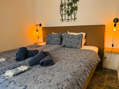 a bedroom with a bed with two pillows at Old Fisherman's Corner 10 - Centro Old Town Albufeira in Albufeira