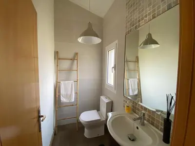 a kitchen with a table and a sink at Charming Villa with pool close to Faro Portugal