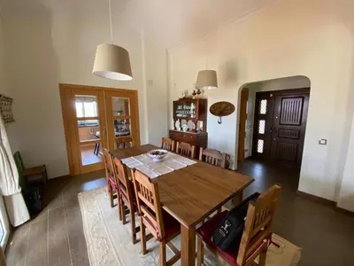 a bathroom with a sink and a toilet and two lights at Charming Villa with pool close to Faro Portugal