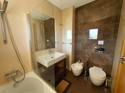 a bathroom with a sink and a toilet and a shower at Varandas do Sol - Olhos de Água in Albufeira