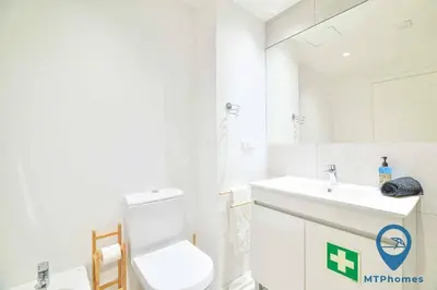 a white bathroom with a toilet and a sink at Vale Mangude A by MTPhomes in Albufeira
