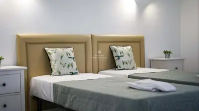two beds sitting next to each other in a room at Aveiros Beach Apartment Ocean View - By Dalma Portuguesa in Albufeira