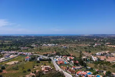 an aerial view of a city with the ocean at Quinta Dionysus in Albufeira
