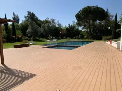 a swimming pool on a brick patio at Vilamoura Concept Villa With Pool by Homing in Vilamoura