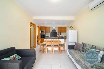a living room with a couch and a table at Vista das Ondas 02B - Dream Lodging in Albufeira