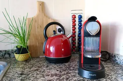 a tea kettle and a blender on a counter at Albufeira Central Apartment, 10 mins walk to beach in Albufeira