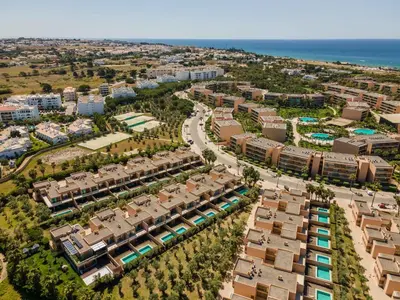 an aerial view of a resort near the ocean at Salgados 2-Bedroom Apartment - 900m from the Beach - Wifi in Guia
