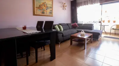 a living room with a couch and a table at Apartamento Pateo - Algarve - BY BEDZY in Albufeira
