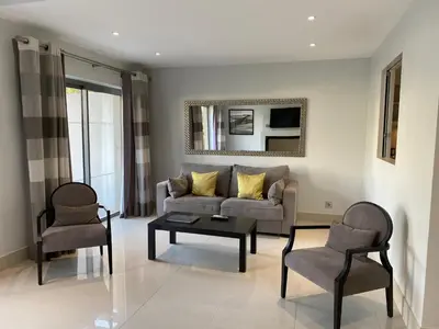 a living room with a couch and two chairs at Vilamoura Pine Hills Villa in Vilamoura